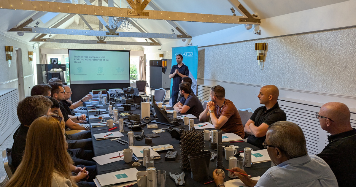 Workshop in session with printers and people engaged in learning